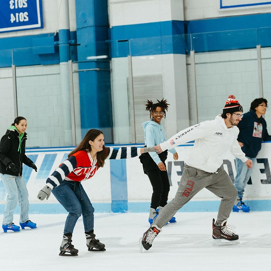 students skate on UMass Boston ice rink